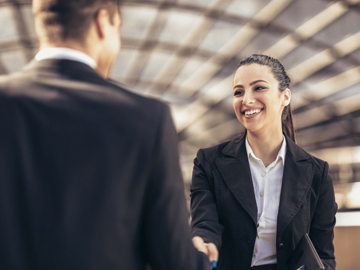 Business man and woman shaking hands