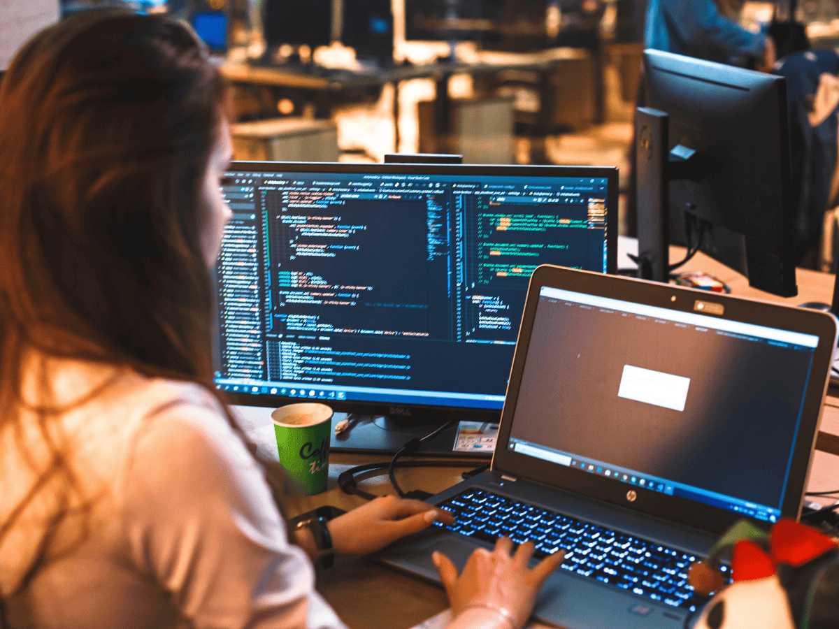 Lady performing web application source code analysis