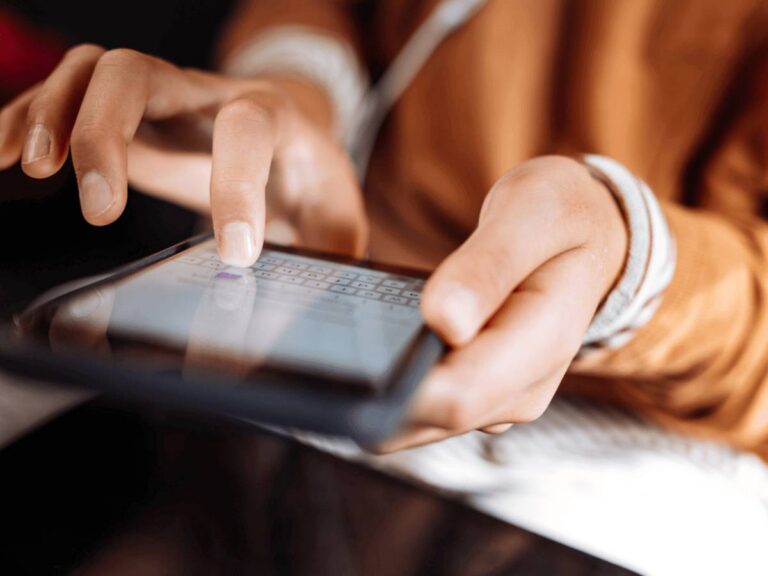 Protect Yourself Online image showing lady using phone to send a message