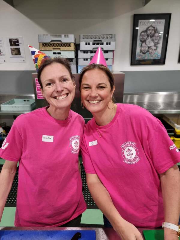 Sentaris employees volunteering at food bank in the kitchen